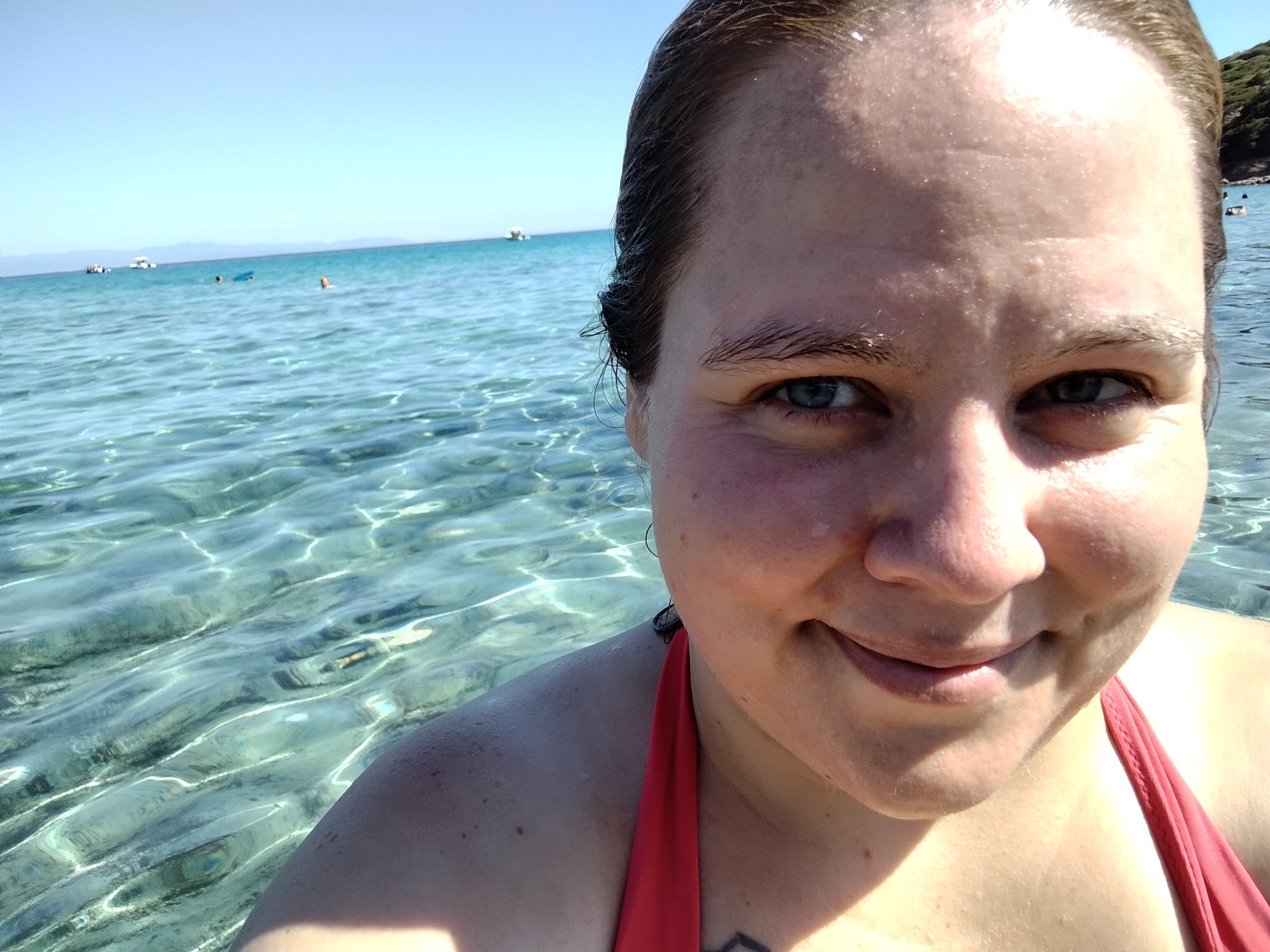 Sam glowing with joy at the beach